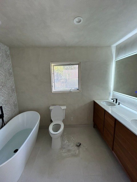 Finished bathroom drywall and plaster interior